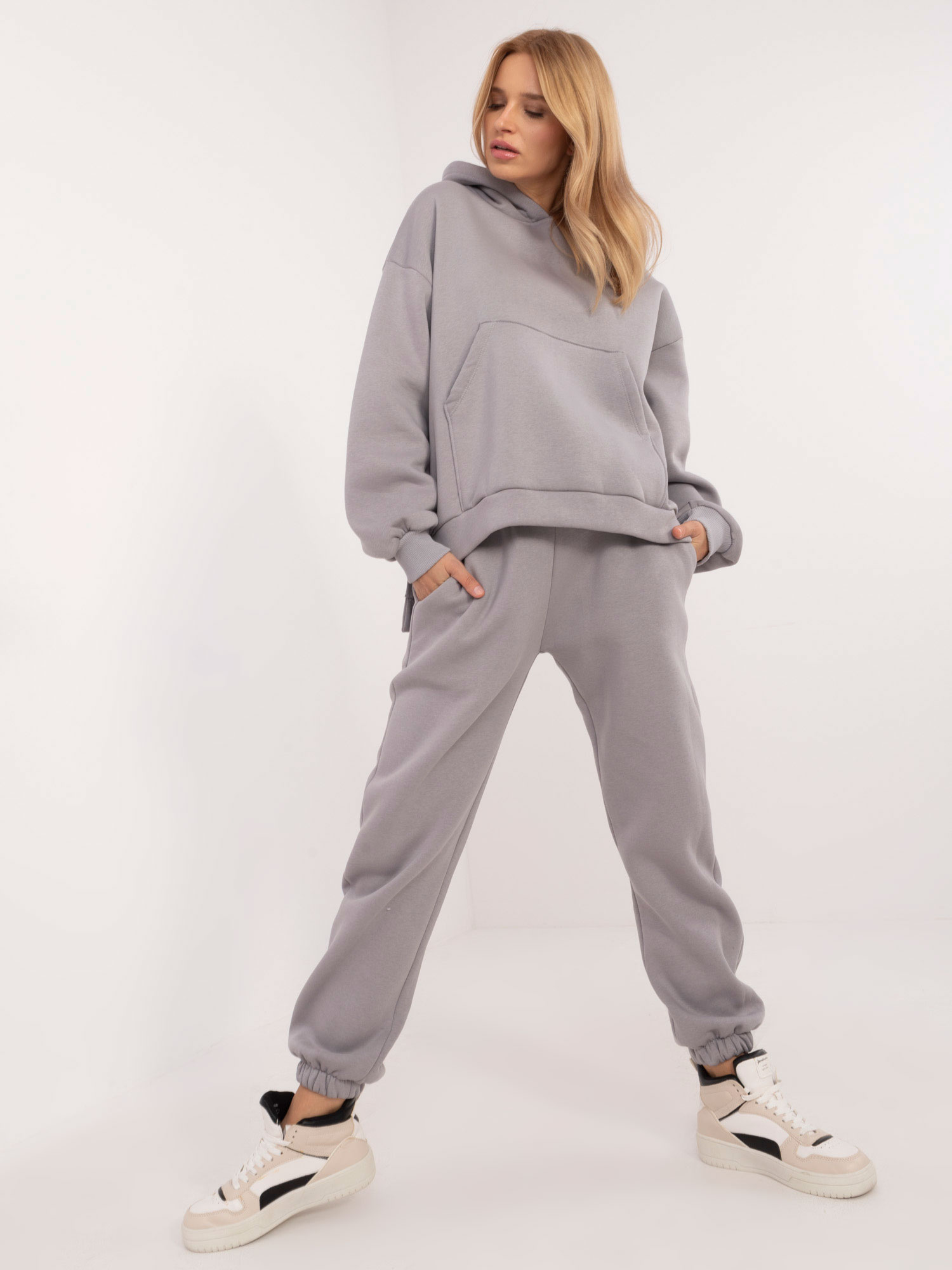 Sivá dámska tepláková súprava s asymetrickou mikinou EM-KMPL-630-2.91- grey Veľkosť: ONE SIZE
