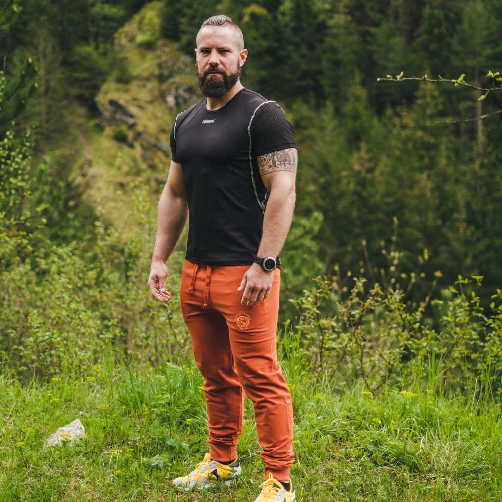 Tehlovo oranžové pánske športové tepláky Veľkosť: M