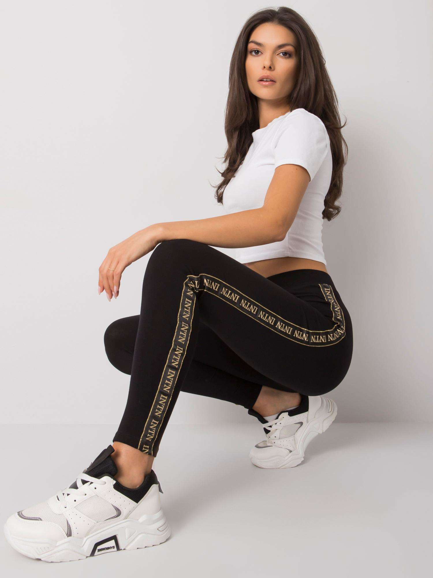 Čierne dámske legíny so zlatými nápismi LA-LG-T-45.78P-black-gold Veľkosť: S