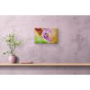 plant in vase sitting on wooden shelf