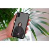 mockup of a woman holding a clear phone case in front of a houseplant 4636 el1