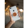 phone grip mockup with string lights in the background 22146