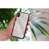 mockup of a woman holding a clear phone case in front of a houseplant 4636 el1 (5)
