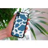 mockup of a woman holding a clear phone case in front of a houseplant 4636 el1 (50)
