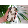 mockup of a woman holding a clear phone case in front of a houseplant 4636 el1 (77)