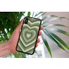 mockup of a woman holding a clear phone case in front of a houseplant 4636 el1 (72)