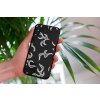mockup of a woman holding a clear phone case in front of a houseplant 4636 el1 (25)