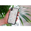 mockup of a woman holding a clear phone case in front of a houseplant 4636 el1 (95)