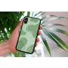 mockup of a woman holding a clear phone case in front of a houseplant 4636 el1 (65)