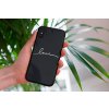 mockup of a woman holding a clear phone case in front of a houseplant 4636 el1 (5)
