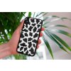 mockup of a woman holding a clear phone case in front of a houseplant 4636 el1 (19)