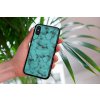 mockup of a woman holding a clear phone case in front of a houseplant 4636 el1