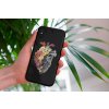 mockup of a woman holding a clear phone case in front of a houseplant 4636 el1 (35)
