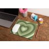 mockup of a mousepad lying on a rustic table next to a flower vase 27554