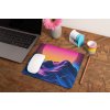 mockup of a mousepad lying on a rustic table next to a flower vase 27554 (1)