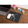 mockup of a mousepad lying on a rustic table next to a flower vase 27554