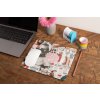 mockup of a mousepad lying on a rustic table next to a flower vase 27554