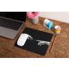 mockup of a mousepad lying on a rustic table next to a flower vase 27554