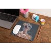 mockup of a mousepad lying on a rustic table next to a flower vase 27554