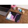 mockup of a mousepad lying on a rustic table next to a flower vase 27554