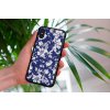 mockup of a woman holding a clear phone case in front of a houseplant 4636 el1 2022 04 20T094828.921