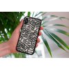 mockup of a woman holding a clear phone case in front of a houseplant 4636 el1 (29)