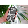 mockup of a woman holding a clear phone case in front of a houseplant 4636 el1 2022 04 20T124848.406