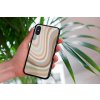 mockup of a woman holding a clear phone case in front of a houseplant 4636 el1 2022 04 12T145411.183