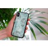 mockup of a woman holding a clear phone case in front of a houseplant 4636 el1 (37)