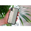 mockup of a woman holding a clear phone case in front of a houseplant 4636 el1 2022 04 19T143705.269