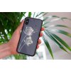 mockup of a woman holding a clear phone case in front of a houseplant 4636 el1 2022 05 04T105059.206