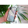 mockup of a woman holding a clear phone case in front of a houseplant 4636 el1 2022 05 04T131317.890