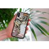 mockup of a woman holding a clear phone case in front of a houseplant 4636 el1 2022 05 04T134911.875