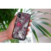 mockup of a woman holding a clear phone case in front of a houseplant 4636 el1 2022 04 26T123521.509