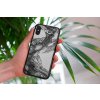 mockup of a woman holding a clear phone case in front of a houseplant 4636 el1 2022 04 26T135124.119