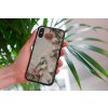 mockup of a woman holding a clear phone case in front of a houseplant 4636 el1 2022 05 18T134825.079