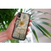 mockup of a woman holding a clear phone case in front of a houseplant 4636 el1 2022 05 23T145253.544