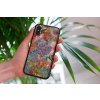 mockup of a woman holding a clear phone case in front of a houseplant 4636 el1 2022 05 18T144045.725