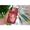 mockup of a woman holding a clear phone case in front of a houseplant 4636 el1 2022 04 26T122324.329