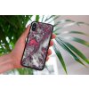 mockup of a woman holding a clear phone case in front of a houseplant 4636 el1 2022 04 26T123521.509