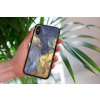 mockup of a woman holding a clear phone case in front of a houseplant 4636 el1 2022 04 26T124304.594