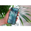mockup of a woman holding a clear phone case in front of a houseplant 4636 el1 2022 04 26T134925.943