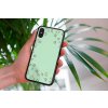 mockup of a woman holding a clear phone case in front of a houseplant 4636 el1 (24)