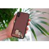 mockup of a woman holding a clear phone case in front of a houseplant 4636 el1 (9)