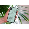 mockup of a woman holding a clear phone case in front of a houseplant 4636 el1 (13)