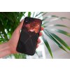 mockup of a woman holding a clear phone case in front of a houseplant 4636 el1 (41)