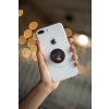 phone grip mockup with string lights in the background 22146