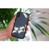 mockup of a woman holding a clear phone case in front of a houseplant 4636 el1 (31)