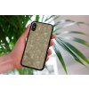 mockup of a woman holding a clear phone case in front of a houseplant 4636 el1 (49)