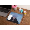 mockup of a mousepad lying on a rustic table next to a flower vase 27554 (10)